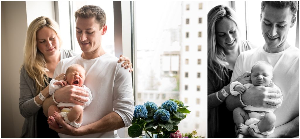 Parents holding newborn at fresh 48 session